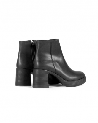 Black ankle-height faux leather booties with block heel and platform sole